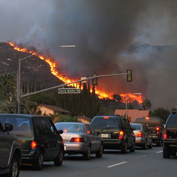 Cars evacuating near Tierra Bonita Road during Cedar Fire