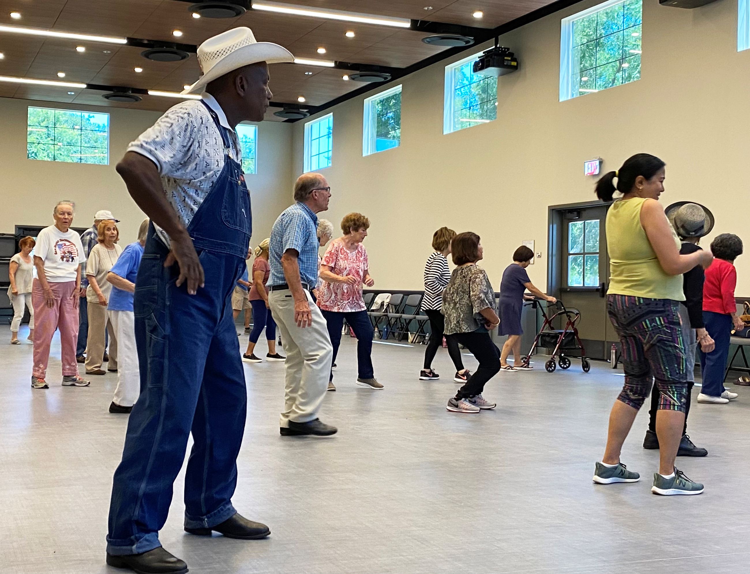 Older Adults Line Dancing in a Room