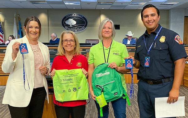 Staff and PNEC volunteer at May 3 council meeting