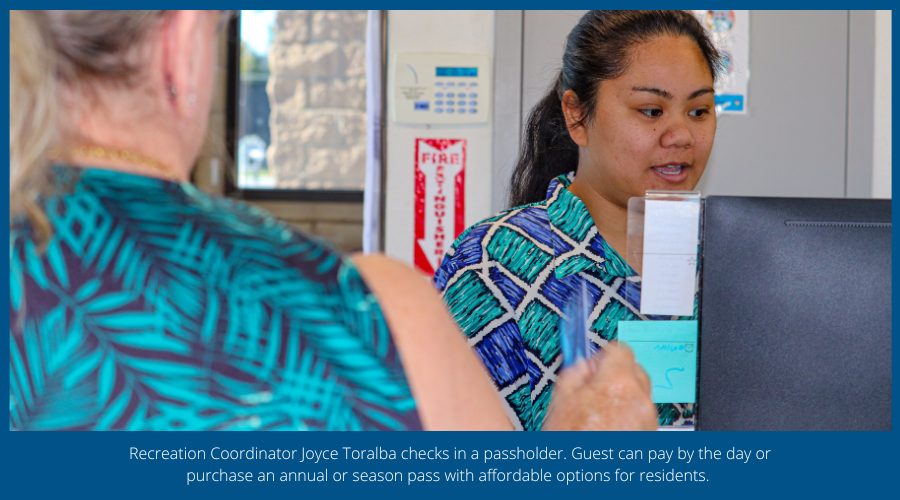Recreation Coordinator Joyce Toralba checks in a passholder.